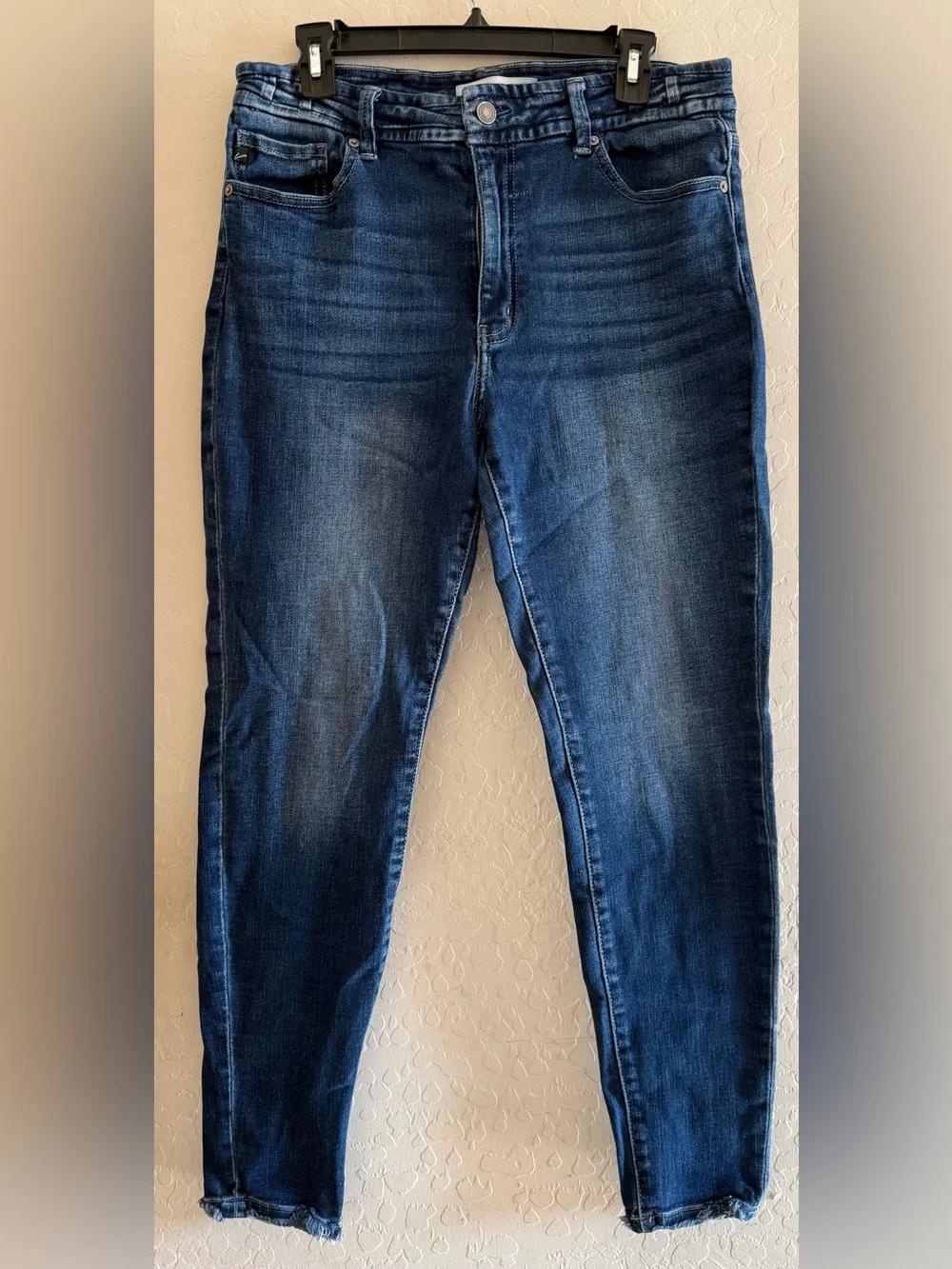 KanCan, size 31, high-rise skinny jeans with a dark wash & a frayed ankle hem